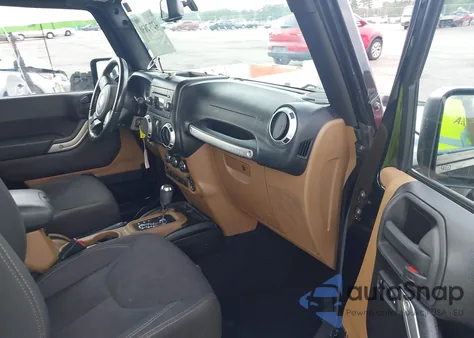 2015 Jeep Wrangler Sahara z USA, uszkodzony, nr VIN 1C4AJWBG4FL605659